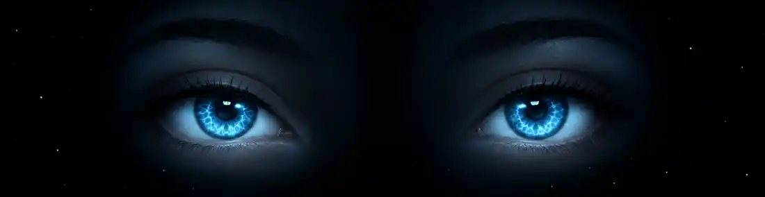 Little Man's friendly blue eyes emerging from the dark.